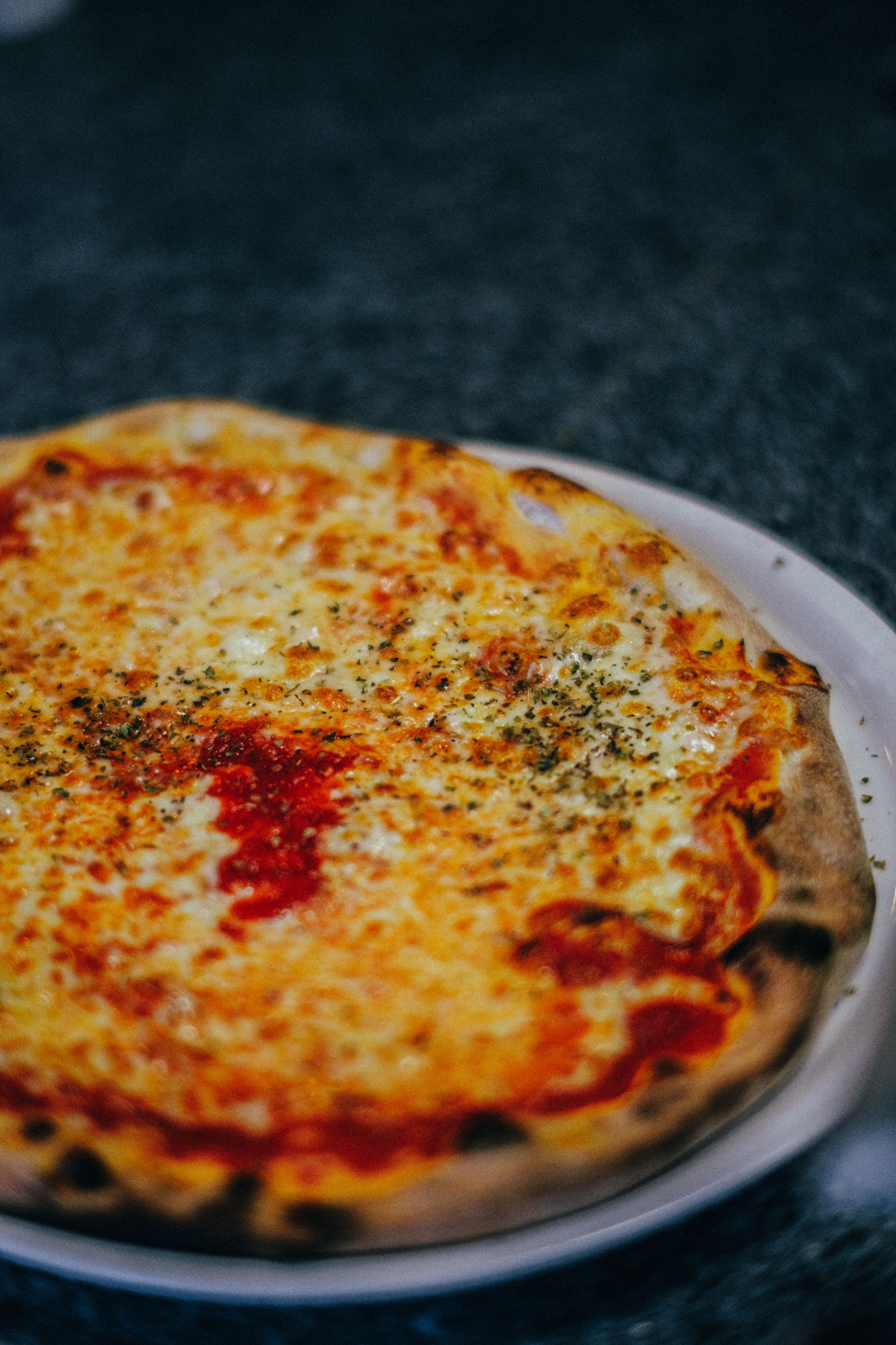Hand-tossed cheese pizza on a plate